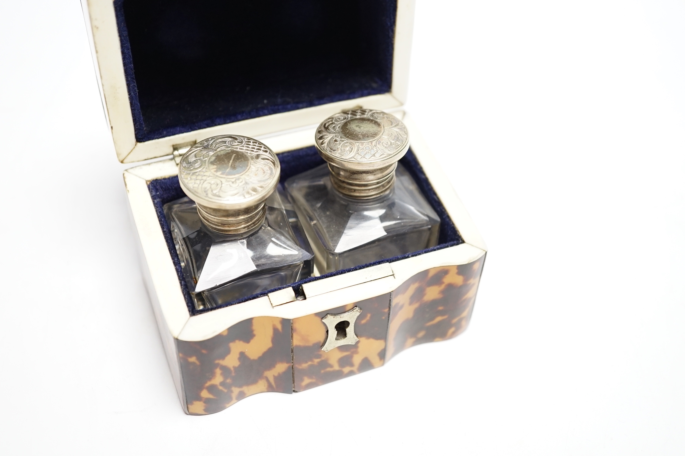 A Victorian tortoiseshell cased pair of glass scent bottles with white metal lids, 9.5cm, CITES Submission reference UN4WUEH8